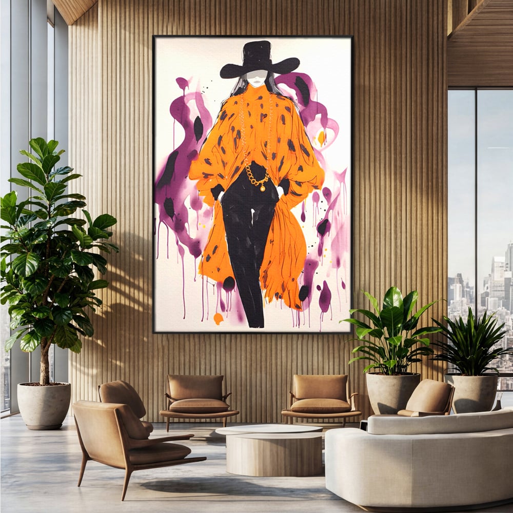 Tablou canvas cu ilustratie fashion cu femeie in costum portocaliu, in rama de aluminiu negru, pe perete intr-un birou